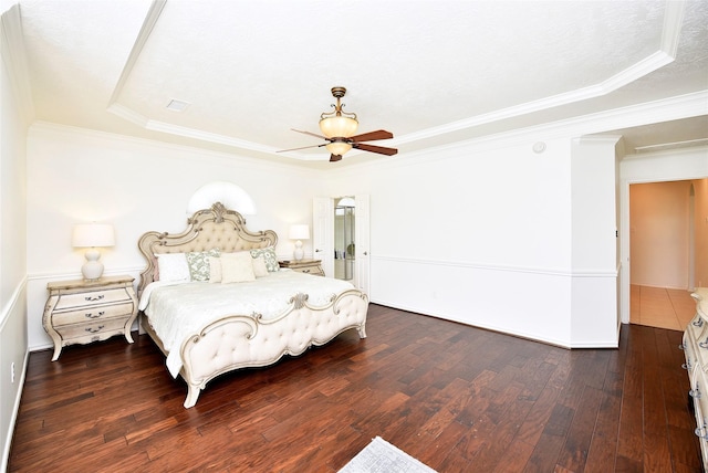 23518 Windy Bank Ln, Richmond, TX 77407 - bedroom with wood finished floors, a tray ceiling, ornamental molding, and a ceiling fan