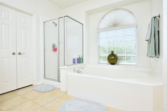 23518 Windy Bank Ln, Richmond, TX 77407 - full bathroom featuring tile patterned floors, a bath, and a stall shower