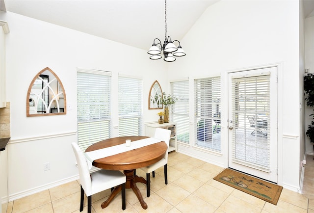 23518 Windy Bank Ln, Richmond, TX 77407 - dining space with a chandelier, high vaulted ceiling, light tile patterned floors, and baseboards
