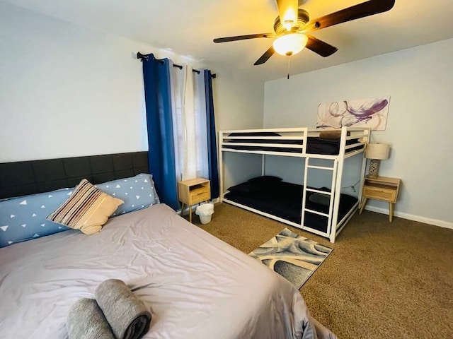 bedroom featuring carpet flooring, a ceiling fan, and baseboards