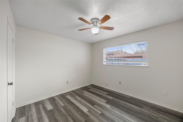 empty room featuring a ceiling fan, a textured ceiling, baseboards, and wood finished floors