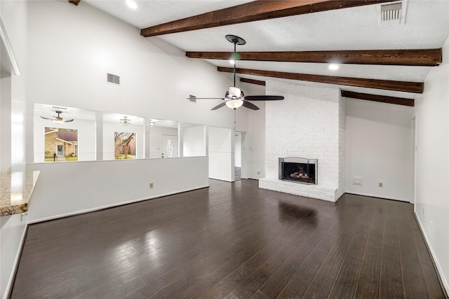 unfurnished living room featuring dark wood-style flooring, a fireplace, visible vents, lofted ceiling with beams, and a ceiling fan