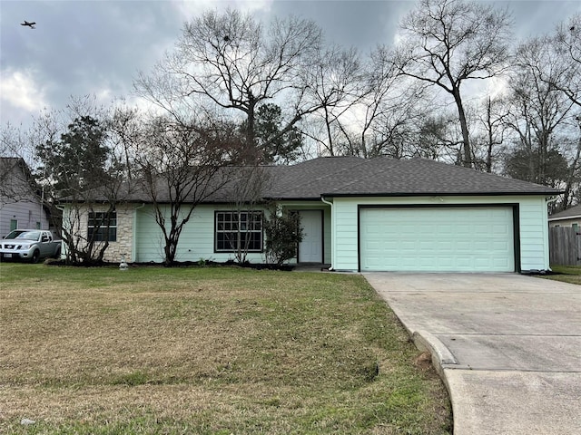 view of front of home with a shingled roof, a front yard, fence, a garage, and driveway