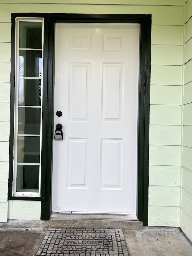 property entrance with concrete block siding