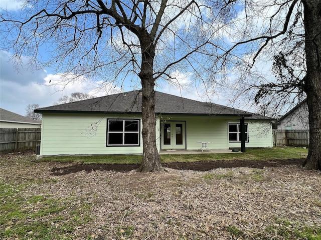 back of house with fence, french doors, and a patio