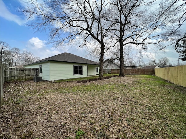 view of yard with a fenced backyard and cooling unit