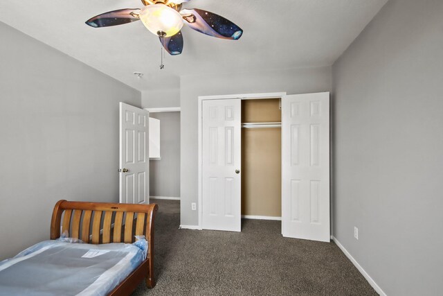 carpeted bedroom with a closet, ceiling fan, and baseboards