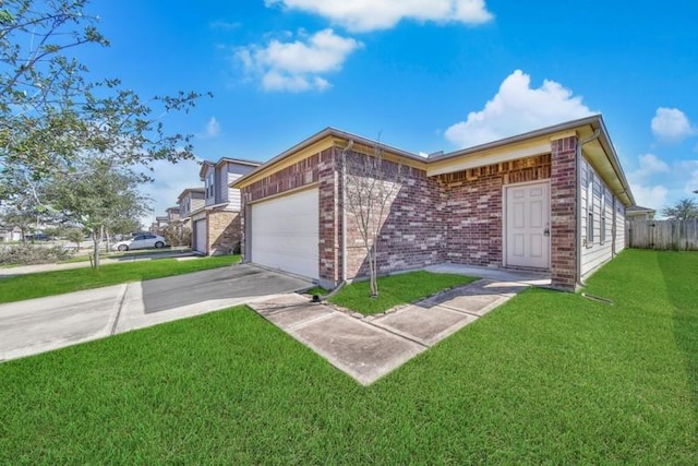 view of front facade featuring brick siding, concrete driveway, an attached garage, a front yard, and fence