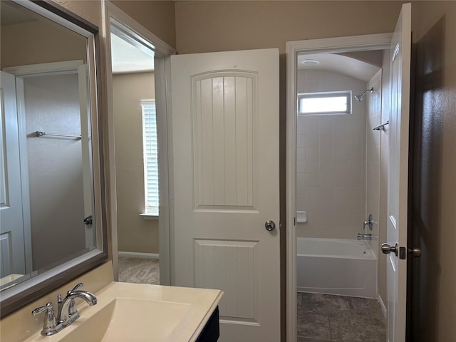 full bathroom with shower / bath combination, vanity, and baseboards