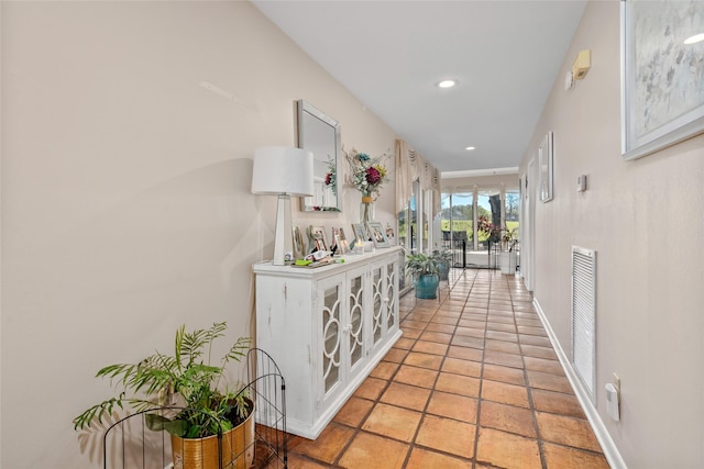 hallway featuring visible vents and recessed lighting