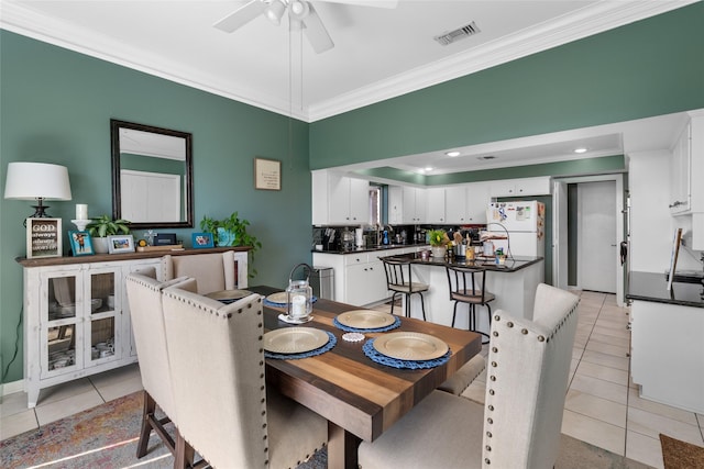 2526 Country Club Blvd, Sugar Land, TX 77478 - dining area featuring crown molding, light tile patterned floors, and a ceiling fan