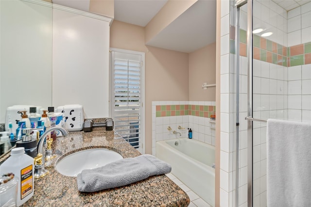 full bathroom with a garden tub, a shower stall, tile patterned flooring, and vanity