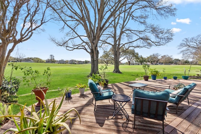 wooden terrace with a lawn