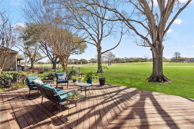 wooden terrace with fence and a lawn