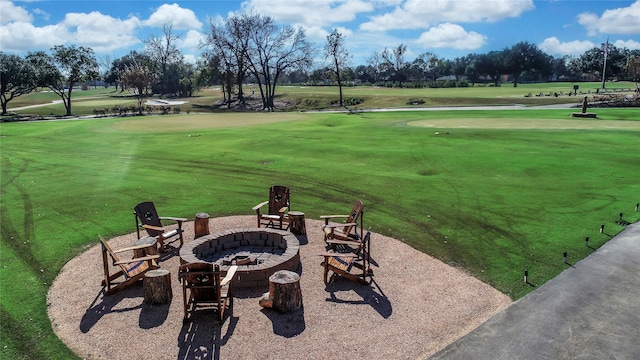 2526 Country Club Blvd, Sugar Land, TX 77478 - exterior space featuring golf course view, a fire pit, a patio, and a yard