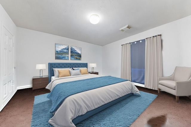 carpeted bedroom featuring visible vents and baseboards