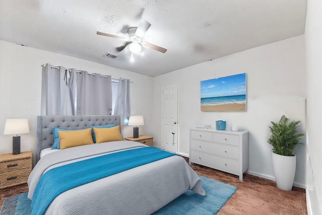 bedroom featuring carpet flooring, a ceiling fan, visible vents, and baseboards