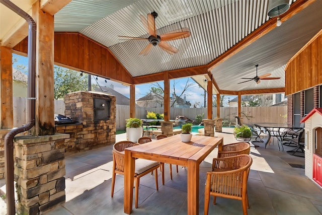 view of patio with a fenced in pool, outdoor dining area, a fenced backyard, and ceiling fan