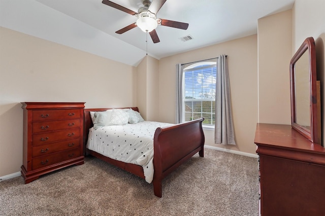 bedroom featuring a ceiling fan, baseboards, visible vents, carpet floors, and lofted ceiling