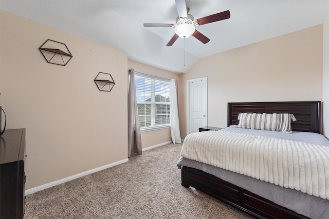 bedroom with vaulted ceiling, baseboards, carpet floors, and ceiling fan