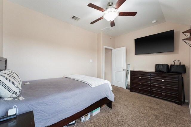 carpeted bedroom with visible vents, a ceiling fan, and lofted ceiling