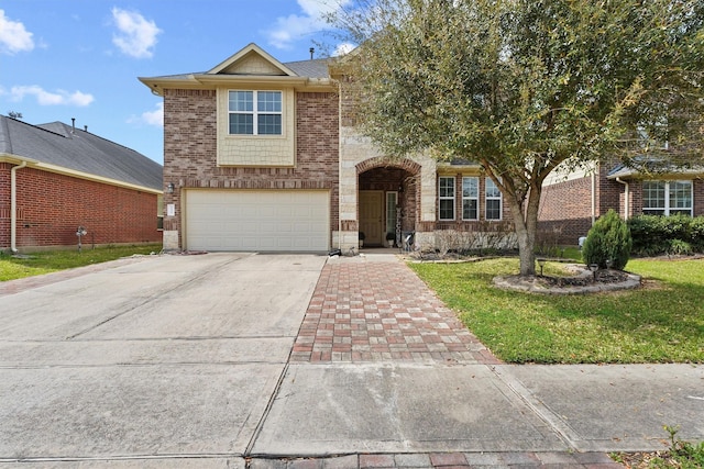 traditional-style home featuring brick siding, an attached garage, and concrete driveway