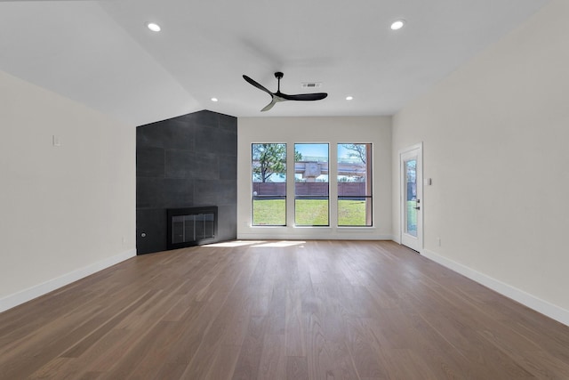 unfurnished living room with recessed lighting, a fireplace, wood finished floors, visible vents, and baseboards