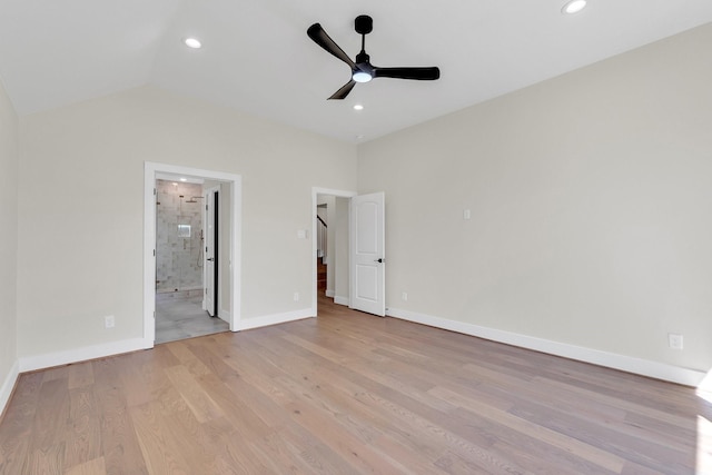 unfurnished bedroom featuring light wood finished floors, baseboards, lofted ceiling, ensuite bathroom, and recessed lighting