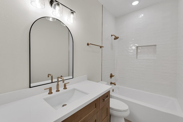 bathroom with toilet, tub / shower combination, and vanity