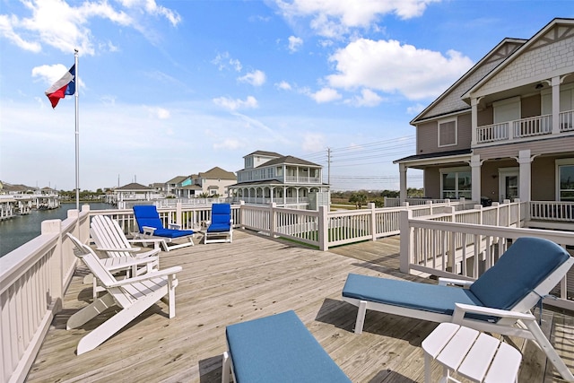 wooden terrace with a water view