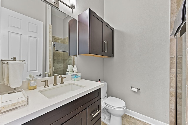 full bath with a shower stall, toilet, vanity, and baseboards