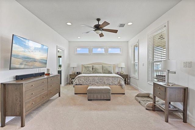 bedroom featuring recessed lighting, baseboards, visible vents, and light carpet