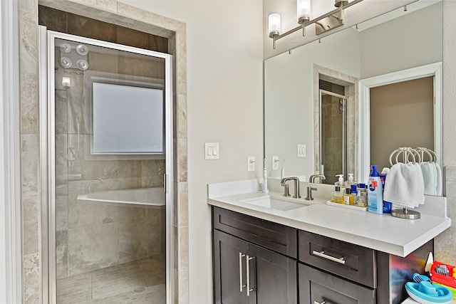 full bath with vanity and a stall shower