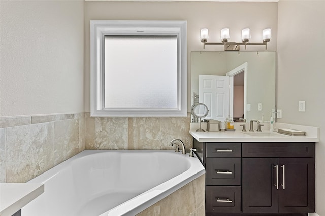 full bath with vanity and a garden tub