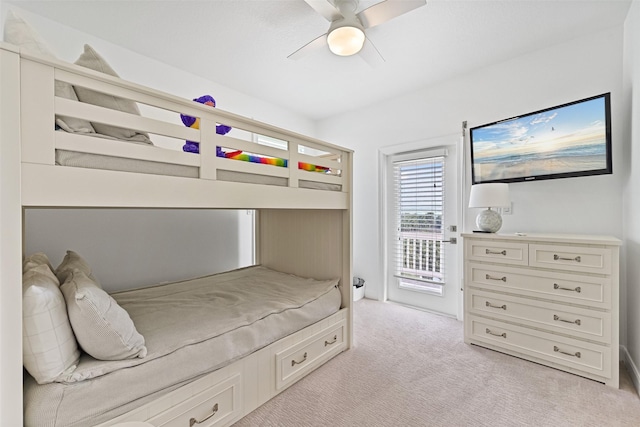 bedroom with light carpet, access to exterior, and a ceiling fan