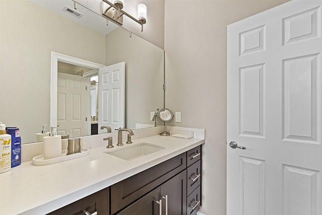 bathroom with visible vents and vanity