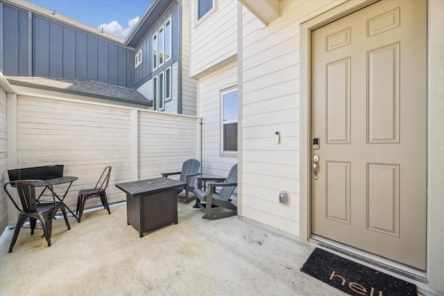 entrance to property with a patio