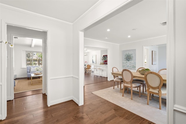 dining area with visible vents, baseboards, ornamental molding, recessed lighting, and wood finished floors