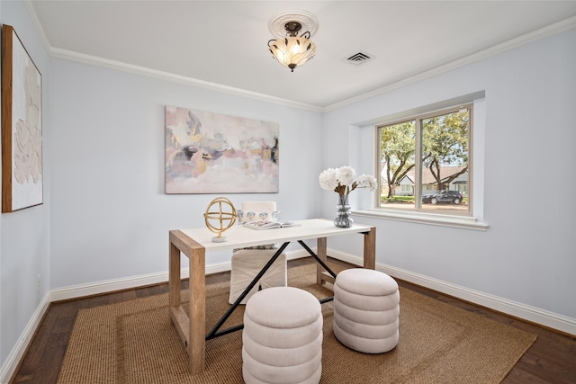 office with crown molding, wood finished floors, visible vents, and baseboards