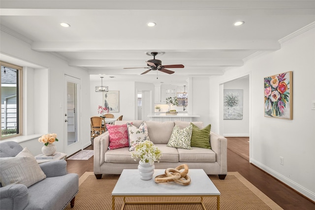 living area with beam ceiling, wood finished floors, recessed lighting, and baseboards