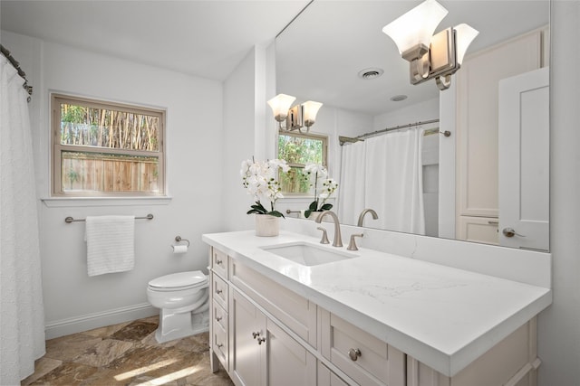 full bathroom with visible vents, baseboards, toilet, stone finish floor, and vanity