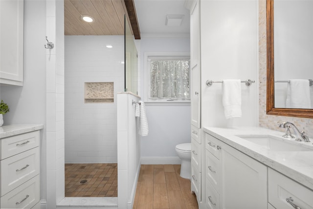 full bathroom with baseboards, walk in shower, toilet, beam ceiling, and vanity