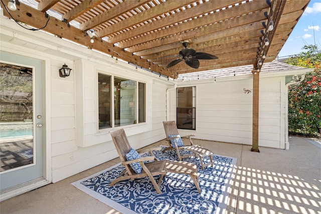 view of patio / terrace featuring a pergola and a ceiling fan