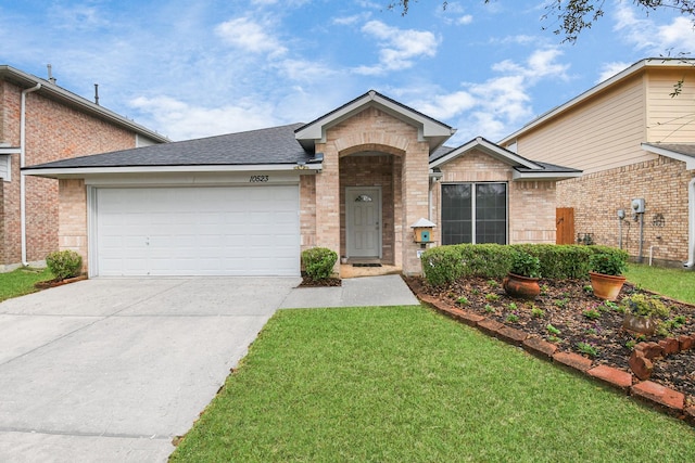 ranch-style house with brick siding, a shingled roof, concrete driveway, an attached garage, and a front yard