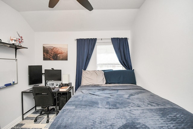 bedroom with a ceiling fan, lofted ceiling, and baseboards