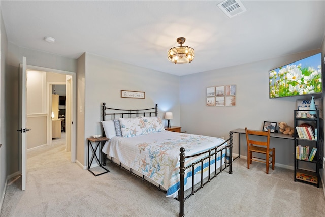 carpeted bedroom featuring visible vents and baseboards