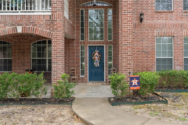 entrance to property with brick siding