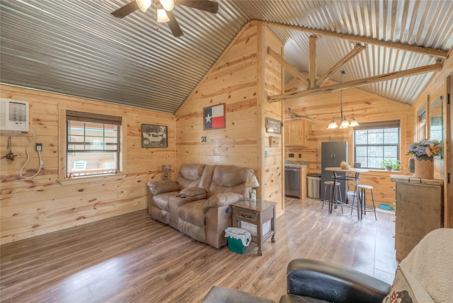 living area with light wood finished floors and wooden walls