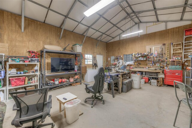 garage featuring metal wall and a workshop area