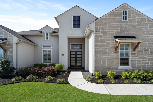 4103 Willowisp Ct, Fulshear, TX 77441 - view of front of house with stucco siding, a front lawn, and french doors